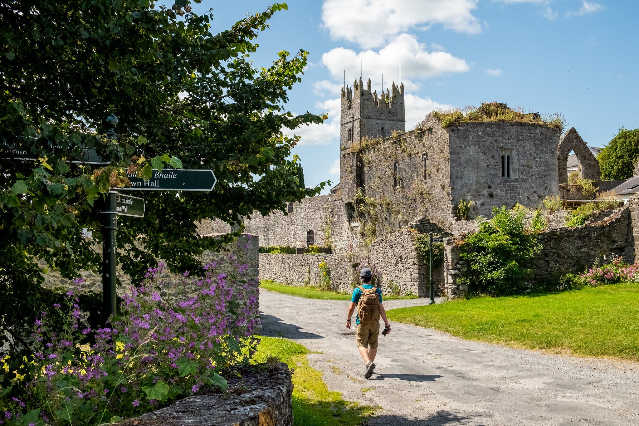 A man hiking by the Fethard medieval town wall in Fethard Co. Tipperary